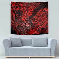 Red and black Polynesian pattern tapestry with ornate swirls and hibiscus-like flowers
