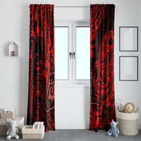Pair of red and black Polynesian patterned curtains hanging beside a white entry
