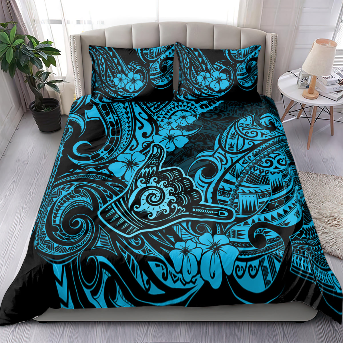 Blue Polynesian patterned bedding set with matching pillowcases, on bed full set view
