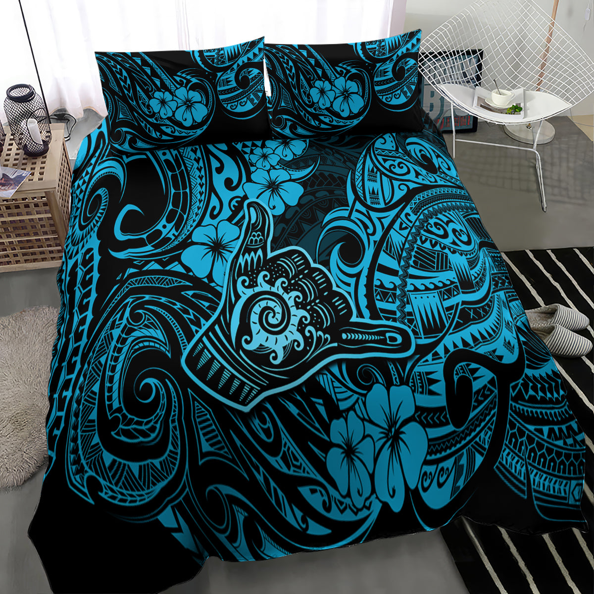 Blue Polynesian patterned bedding set with turquoise tiki-style motifs, three-quarter view