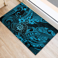 Polynesian motif rubber doormat in blue and black with floral and swirl details