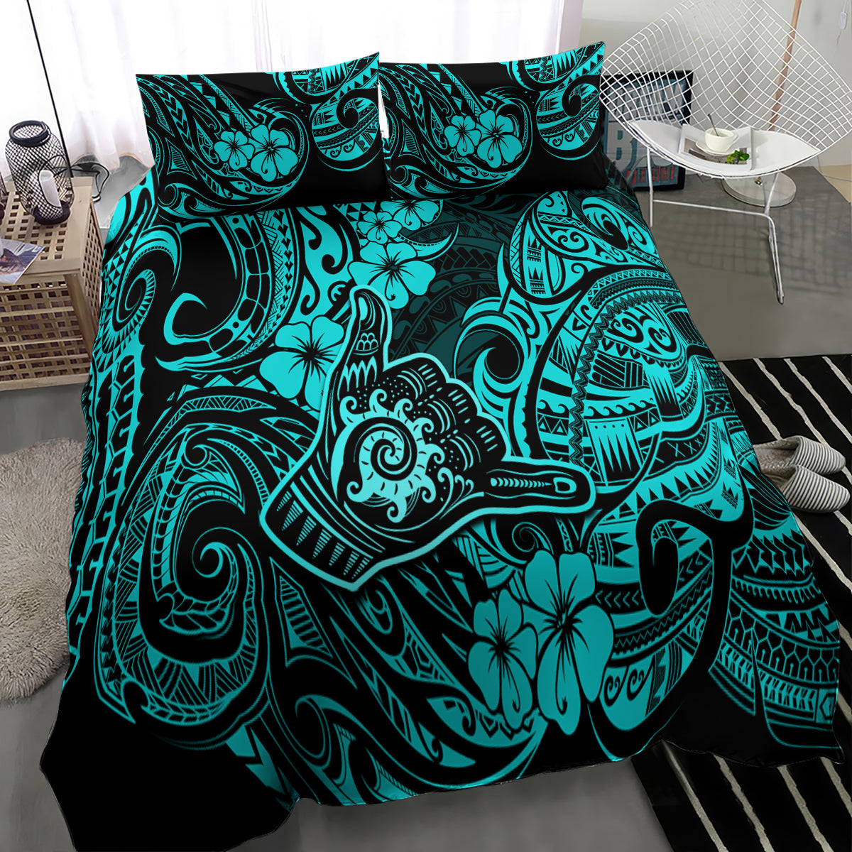 Turquoise and black Polynesian print duvet cover with pillow shams on bed