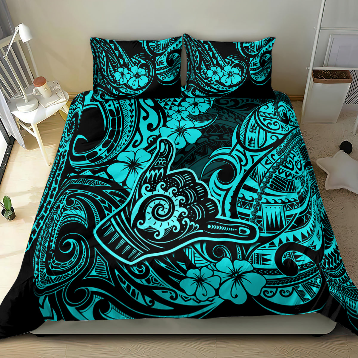 Turquoise and black Polynesian print bedding set with shams on bed
