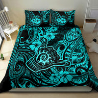 Turquoise and black Polynesian print bedding set with shams on bed