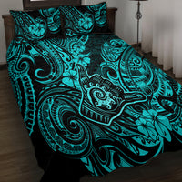 Turquoise and black patterned bed quilt set with two pillow shams, angled view