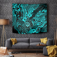 Turquoise patterned tapestry with dark tribal motifs and floral swirls