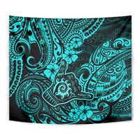 Turquoise patterned tapestry featuring dark swirling lines and hibiscus-like flowers