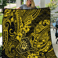 Yellow and black Polynesian shaka sign quilt with bold scroll and flower patterns