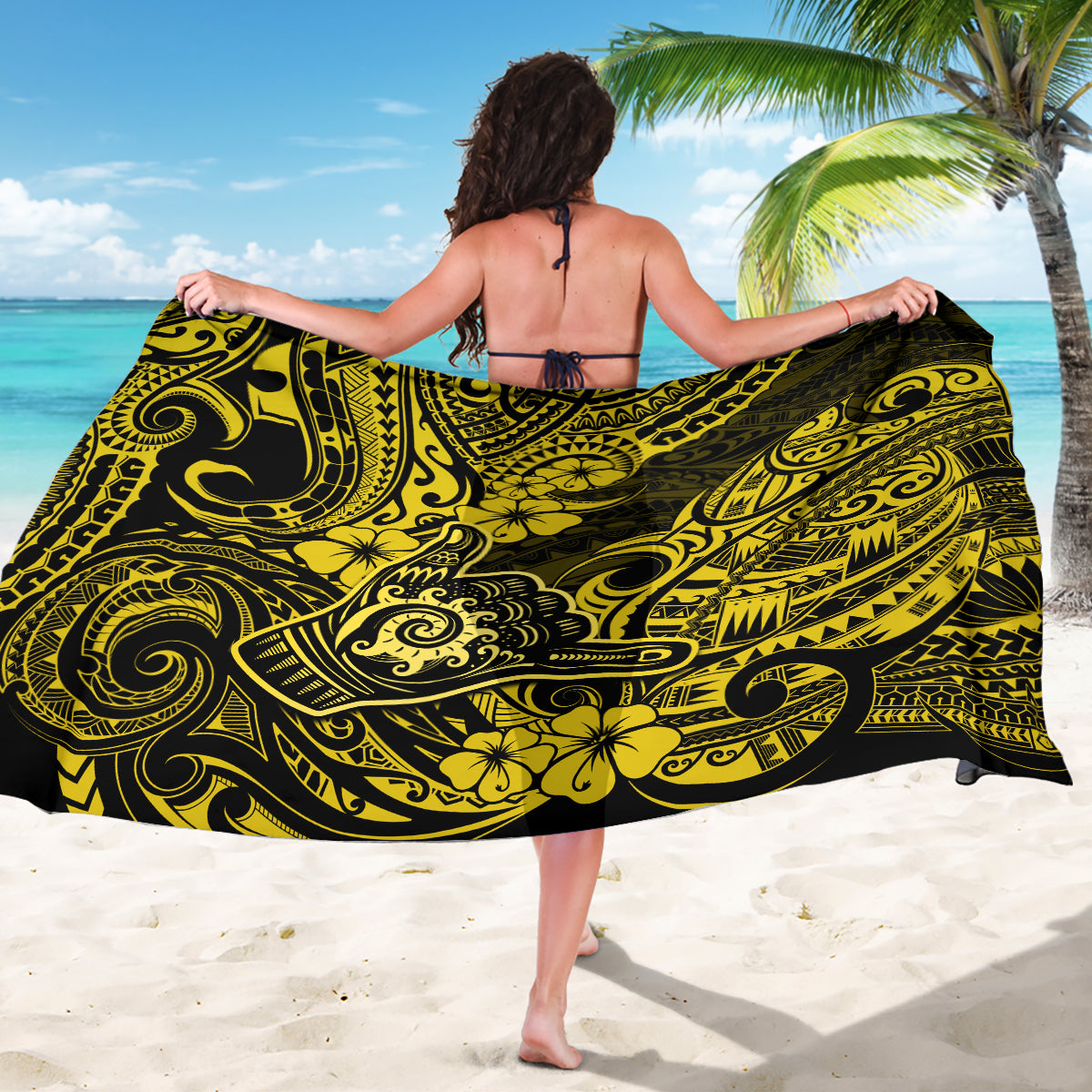 Yellow and black patterned sarong wrap skirt, shown laid flat across the body