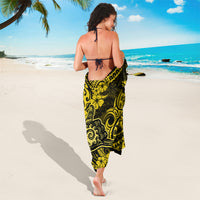 Yellow and black patterned sarong wrap, worn with tie at the back