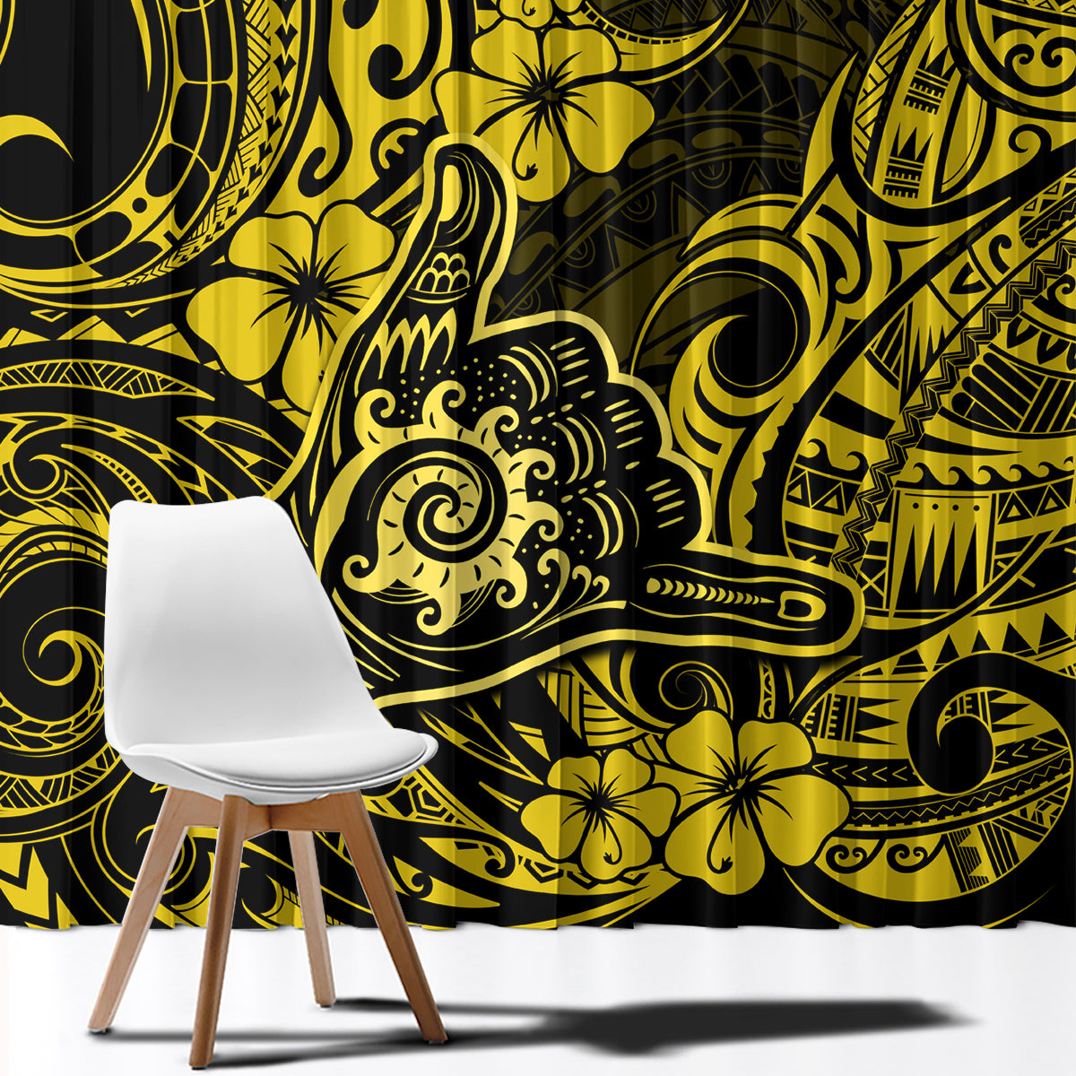 Yellow and black patterned window curtain fabric close-up, tribal swirls and floral motifs