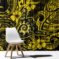 Yellow and black patterned window curtain fabric close-up, tribal swirls and floral motifs