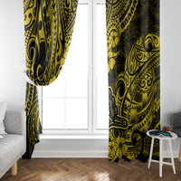 Pair of yellow and black Polynesian window curtains framing a white door