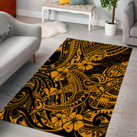 Rectangular gold and black patterned area rug with Polynesian motifs and floral details