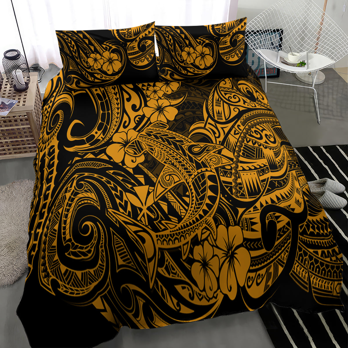 Gold and black Polynesian patterned bedding set with two pillows on bed