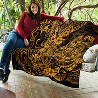 Gold and black Polynesian shark quilt spread out, detailed tribal motifs and flowers
