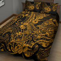 Gold-and-black Polynesian patterned quilt with two standard pillowcases on bed