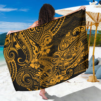 Gold and black patterned sarong with Polynesian motifs, held open wide