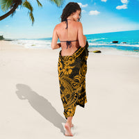Gold and black Polynesian motif sarong, back view with tied straps