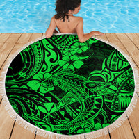 Green round beach blanket with white fringe, tribal shark and hibiscus pattern