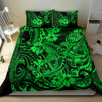 Green Polynesian shark bedding set on bed with matching pillow shams