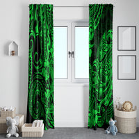 Green and black tribal curtain panels on either side of a white doorway