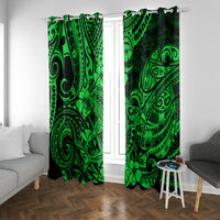 Green and black tribal-pattern curtain panels with intricate swirl motifs on rod