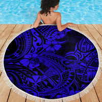 Round navy beach blanket with fringed border and bold Polynesian shark artwork