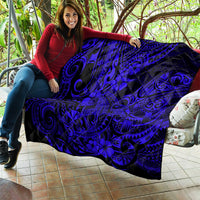 Navy-blue Hawaii shark quilt draped on couch, black swirls and floral hibiscus pattern