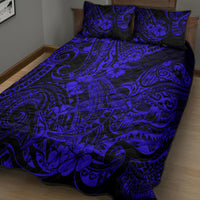 Navy blue quilt bed set with swirling tribal pattern and matching pillow shams