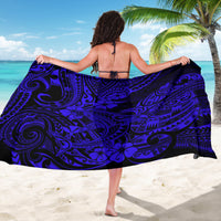 Navy sarong with swirling blue Polynesian pattern, draped with straight hem