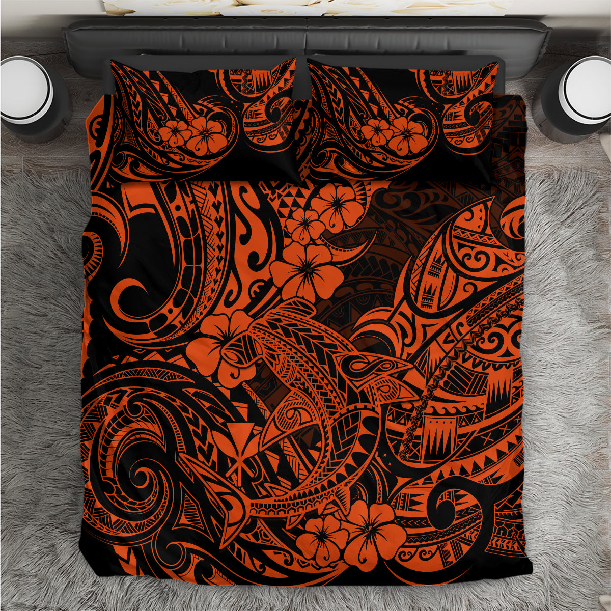 Orange and black Polynesian pattern bedding set, top view of duvet and pillow shams