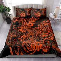 Orange and black Polynesian pattern bedding set on bed with two matching pillow shams