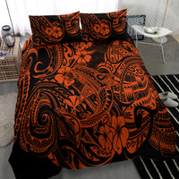 Orange and black Polynesian pattern bedding set with two pillow shams and coordinated duvet