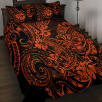 Orange and black Polynesian pattern quilt and pillow shams on bed, side view