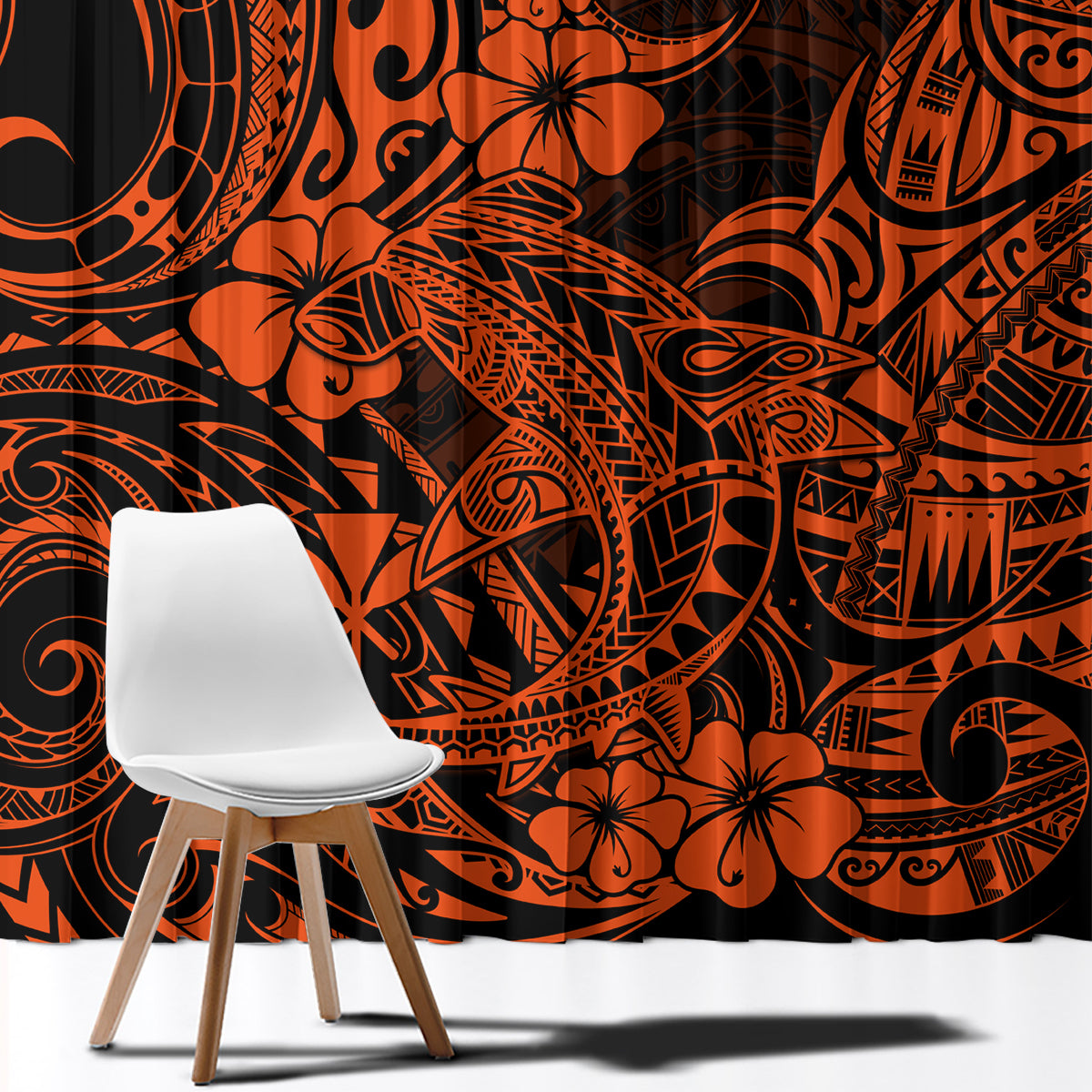 Orange and black Polynesian pattern curtain fabric close-up with bold floral and swirl motifs