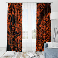 Orange and black Polynesian pattern curtains with dark swirl motifs and rod-hung header