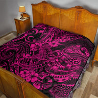 Pink and black Polynesian shark pattern quilt on a bed