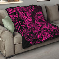 Pink and black Polynesian shark pattern quilt blanket on a sofa
