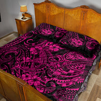 Pink and black Polynesian shark motif quilt set with two pillowcases on bed
