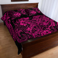 Pink and black Polynesian shark motif quilt with two matching pillowcases on bed