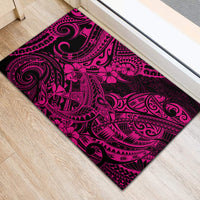 Pink rubber doormat showing black tribal swirls and hibiscus flower details