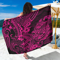 Sarong with pink-and-black Polynesian tribal print, draped with bold scroll motifs.