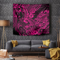 Pink and dark patterned tapestry with Polynesian-style swirls and floral motifs