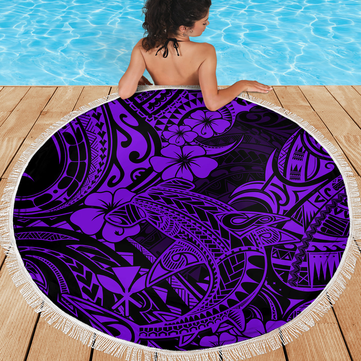 Purple round beach blanket with Polynesian shark pattern and white fringe edge