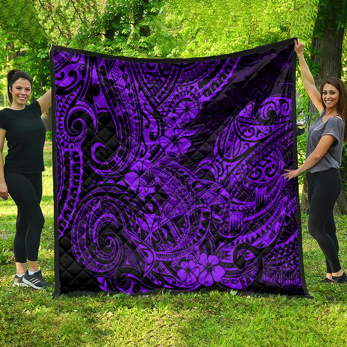 Purple Polynesian-style quilt, black background with ornate swirls and flower motifs