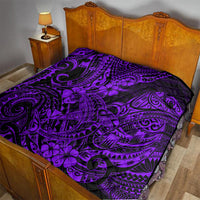 Purple Polynesian-style quilt on a bed with matching black pattern and flower accents
