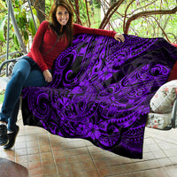Purple Polynesian-style quilt laid out indoors, black background with swirl and flower pattern