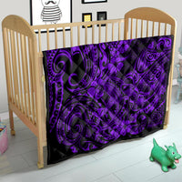 Purple Polynesian-style quilt on a wooden crib, black background with swirl and flower accents