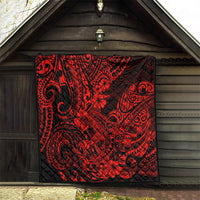 Red and black Polynesian shark pattern quilt, square blanket hung on wooden wall.
